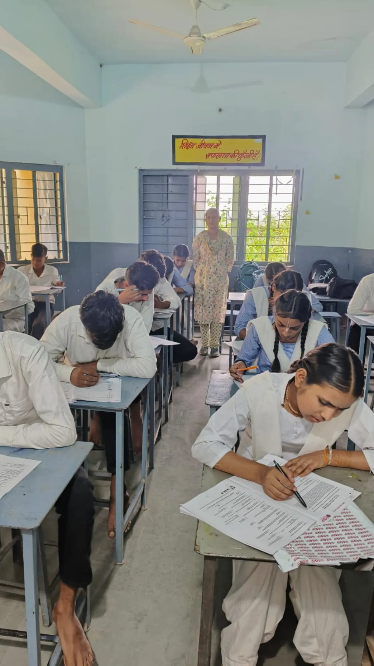 Students writing OMR-based examination in classroom
